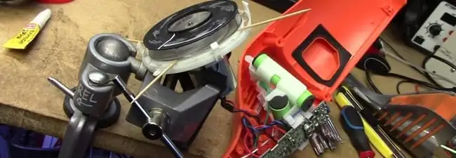 Vacuum cleaner repair parts and tools on a workbench in Fort Collins, CO